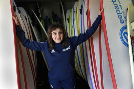 Carmen Lopez Garcia, Spain's first blind female surfer who is to participate in the ISA World Adaptive Surfing Championship, poses before training at Salinas beach, Spain, December 5, 2018. REUTERS/Eloy Alonso