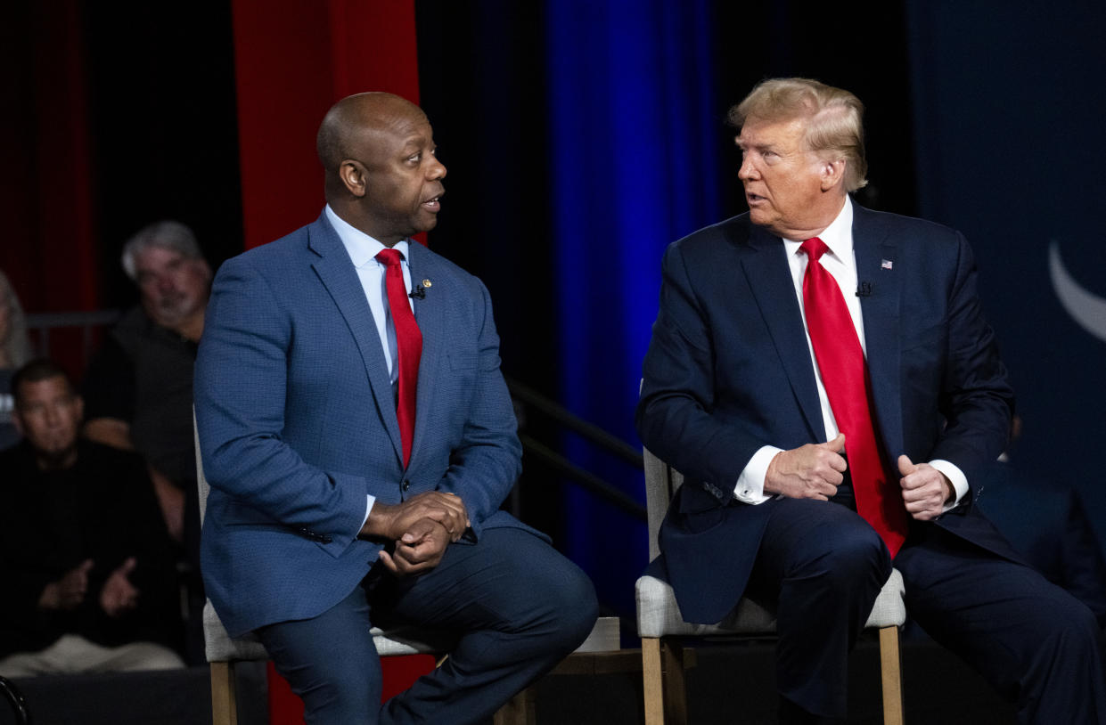 Former President Donald Trump, the presumed Republican presidential nominee, with Sen. Tim Scott (R-S.C.) during a town hall for Fox News in Spartanburg, S.C., Feb. 20, 2024. (Doug Mills/The New York Times)