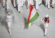 Hungary's flag-bearer Bernadett Heidum leads her country's contingent during the opening ceremony of the 2014 Sochi Winter Olympics, February 7, 2014. REUTERS/Lucy Nicholson (RUSSIA - Tags: OLYMPICS SPORT)