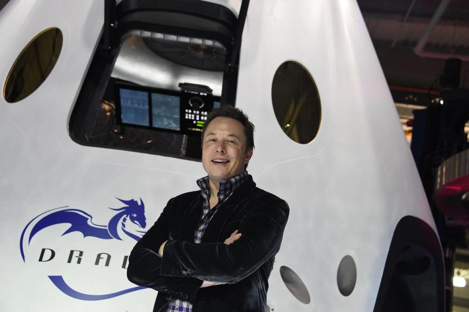 Elon Musk introduces SpaceX's Dragon V2 spacecraft, the companys next generation version of the Dragon ship designed  to carry astronauts into space, at a press conference in Hawthorne, California on May 29, 2014 (AFP via Getty Images)