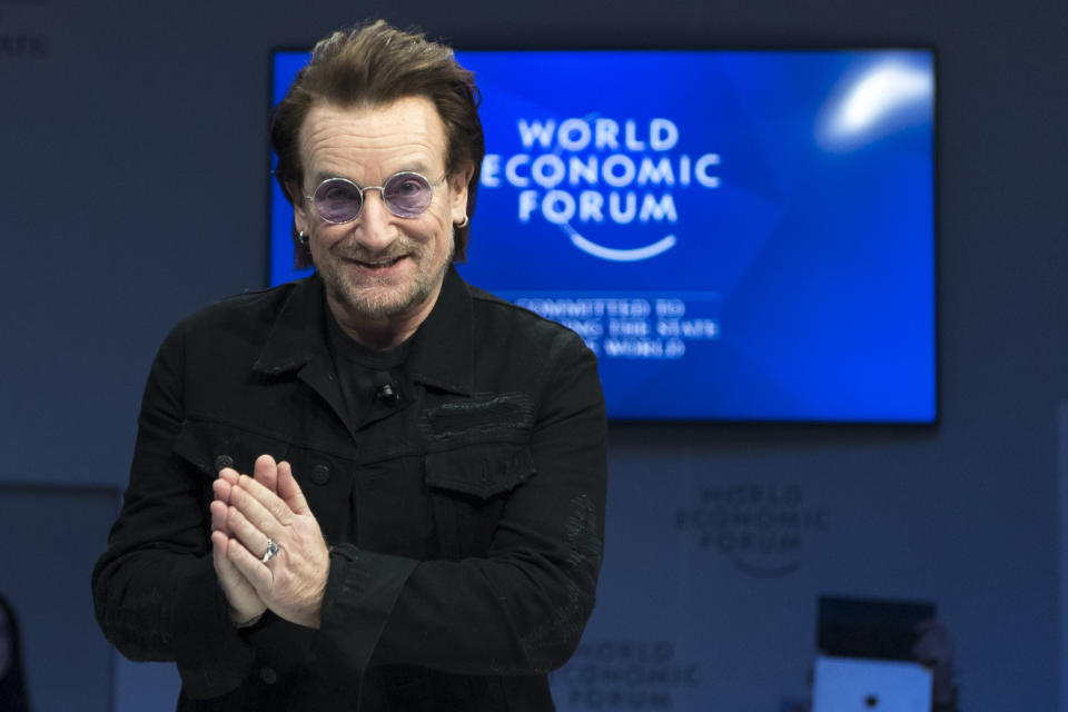 Irish singer Bono gestures as he arrives for a panel session during the the 49th Annual Meeting of the World Economic Forum, WEF, in Davos, Switzerland, Wednesday, Jan. 23, 2019. (Laurent Gillieron/Keystone via AP)