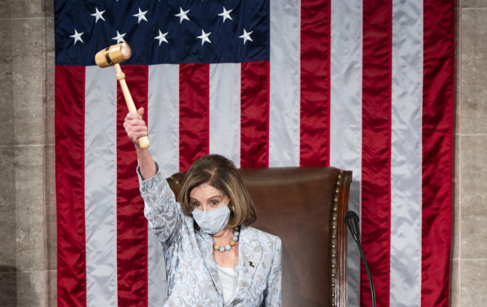 FILE - Speaker of the House Nancy Pelosi of Calif., waves the gavel on the opening day of the 117th Congress on Capitol Hill in Washington, Sunday, Jan. 3, 2021. (Bill Clark/Pool via AP, File)