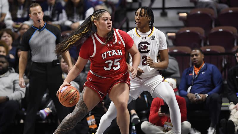Utah forward Alissa Pili (35) is guarded by South Carolina forward Ashlyn Watkins (2) in the first half of an NCAA college basketball game, Sunday, Dec. 10, 2023, in Uncasville, Conn. 