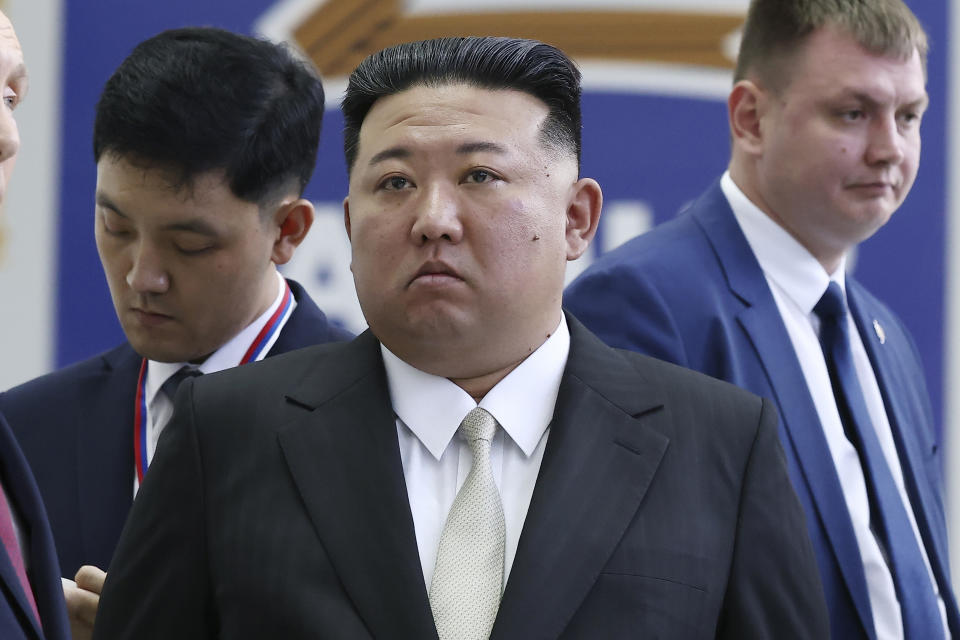 FILE - North Korea's leader Kim Jong Un, center, examines a rocket assembly hangar at the Vostochny Cosmodrome outside the city of Tsiolkovsky, in Russia's Far East, on Wednesday, Sept. 13, 2023. On Friday, Oct. 27, The Associated Press reported on stories circulating online incorrectly claiming a video showing Kim Jong Un saying in a speech that he blames President Joe Biden for the latest Israel-Hamas war. (Vladimir Smirnov, Sputnik, Kremlin Pool Photo via AP, File)