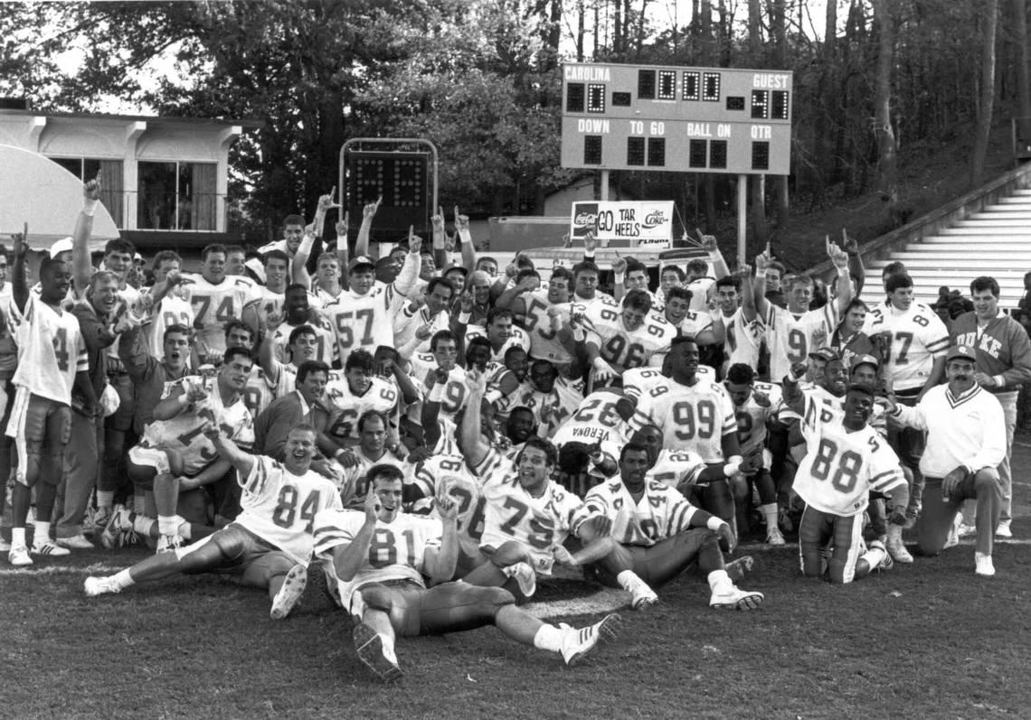 Duke football caoch Steve Spurrier and his team pose in frontot of the scorebaord after defeating the UNC Tar Heels 41-0 in Kenan Stadium November 18, 1989. Courtesy of the Duke Sports Information. 