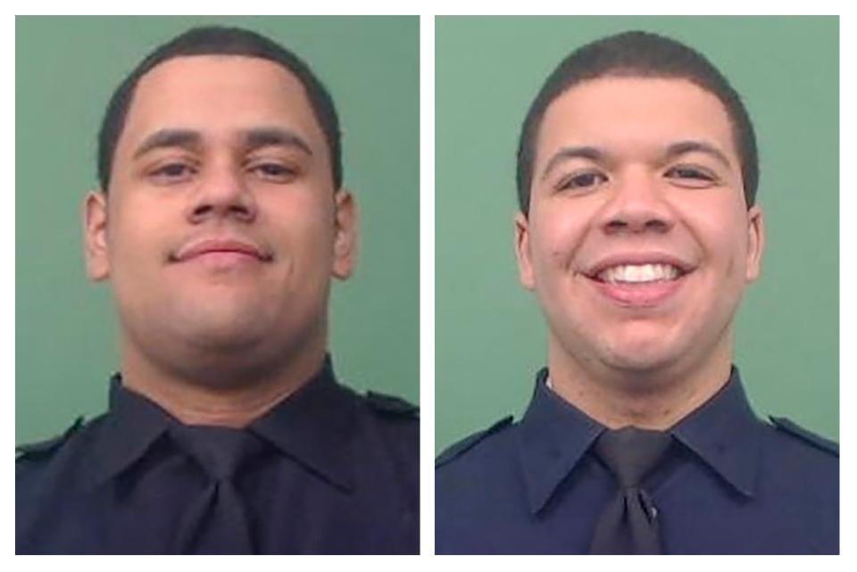 NYPD Officers Wilbert Mora, left, and Jason Rivera were shot while answering a call about an argument between a woman and her adult son in the Harlem neighborhood of New York on Friday.