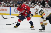 Vegas Golden Knights left wing William Carrier (28) defends against Washington Capitals left wing Alex Ovechkin (8) during the second period of an NHL hockey game, Monday, Jan. 24, 2022, in Washington. (AP Photo/Evan Vucci)