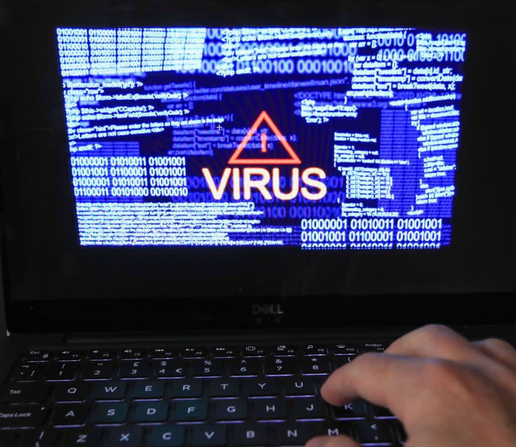 A laptop screen showing a computer virus warning (PA) (PA Archive)