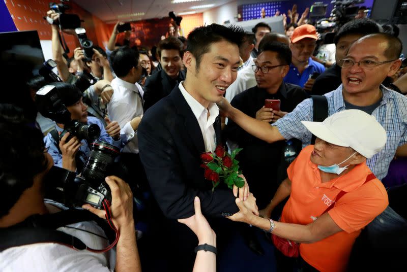 Future Forward Party leader Thanathorn Juangroongruangkit greets his supporters at the party's headquarters in Bangkok