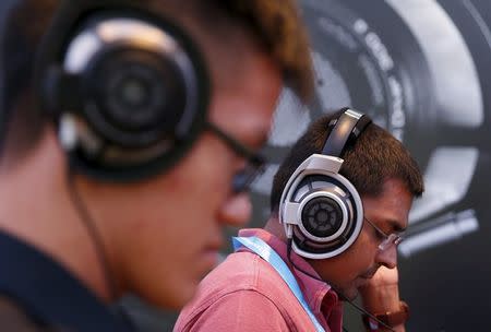 People test headphones during the CanJam headphone and personal audio expo in Singapore February 21, 2016. REUTERS/Edgar Su