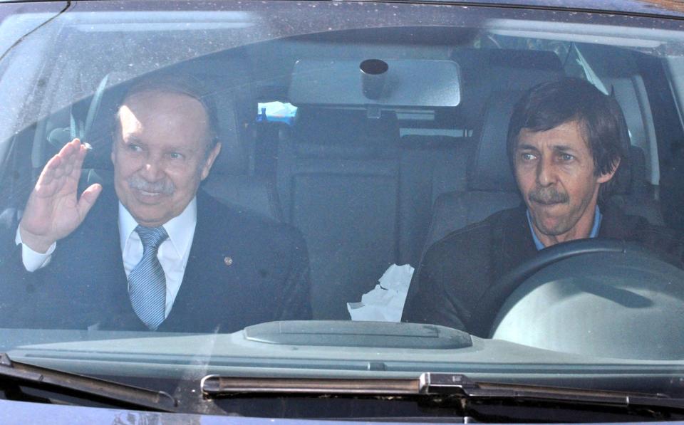 FILE - In this Friday April 10, 2009, file photo shows Algerian President Abdelaziz Bouteflika, left, and his brother, Said Bouteflika, arrive at his campaign headquarters in the Hydra district of Algiers, a day after the Algerian presidential election. In Algeria, which has been run by a succession of military men for decades, presidential elections often are foregone conclusion. But not this year. The campaign for the April vote already is raising questions: Will the ailing president run for re-election? If not, will his supporters and the powerful intelligence services be able to agree on someone else? And where does Algeria’s army stand in all this? With the lack of any clear direction from on top, political squabbles are being fought in the media, with the head of the governing party decrying the shadowy intelligence chief’s grip on power, and a journalist accusing the president’s brother of corruption and scandalous personal behavior. (AP Photo, File)