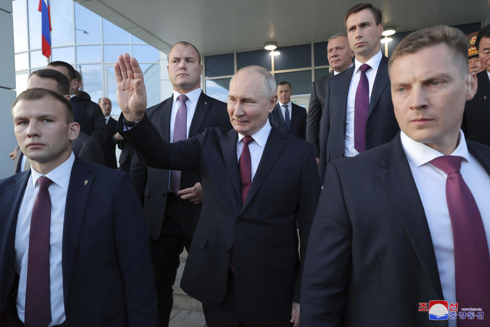 In this photo provided by the North Korean government, Russian President Vladimir Putin, center, sends off North Korean leader Kim Jong Un after their meeting at the Vostochny cosmodrome outside the city of Tsiolkovsky, about 200 kilometers (125 miles) from the city of Blagoveshchensk in the far eastern Amur region, Russia, Wednesday, Sept. 13, 2023. Independent journalists were not given access to cover the event depicted in this image distributed by the North Korean government. The content of this image is as provided and cannot be independently verified. Korean language watermark on image as provided by source reads: "KCNA" which is the abbreviation for Korean Central News Agency. (Korean Central News Agency/Korea News Service via AP)
