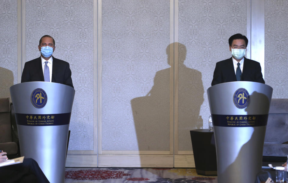 U.S. Health and Human Services Secretary Alex Azar, left, speaks, along with Taiwanese Foreign Minister Joseph Wu at the start of their meeting in Taipei, Taiwan Tuesday, Aug. 11, 2020. Azar met with Wu on Tuesday during the highest-level visit by an American Cabinet official since the break in formal diplomatic ties between Washington and Taipei in 1979. (AP Photo/Chiang Ying-ying)