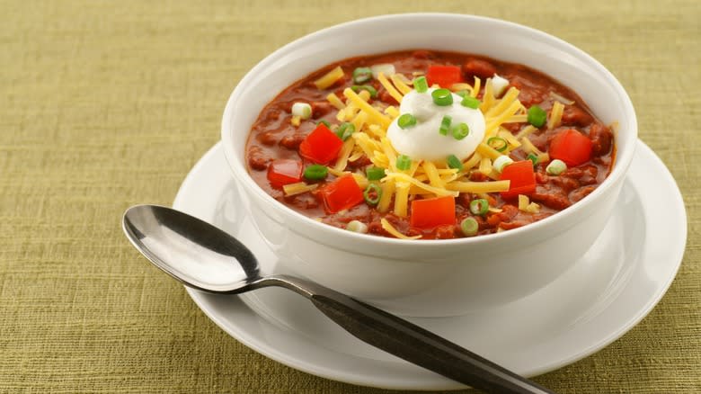 Bowl of chili with garnish