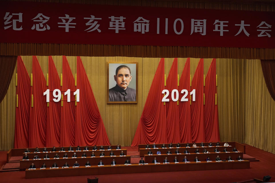 Chinese President Xi Jinping, center, delivers a speech at an event commemorating the 110th anniversary of Xinhai Revolution at the Great Hall of the People in Beijing, Saturday, Oct. 9, 2021. (AP Photo/Andy Wong)