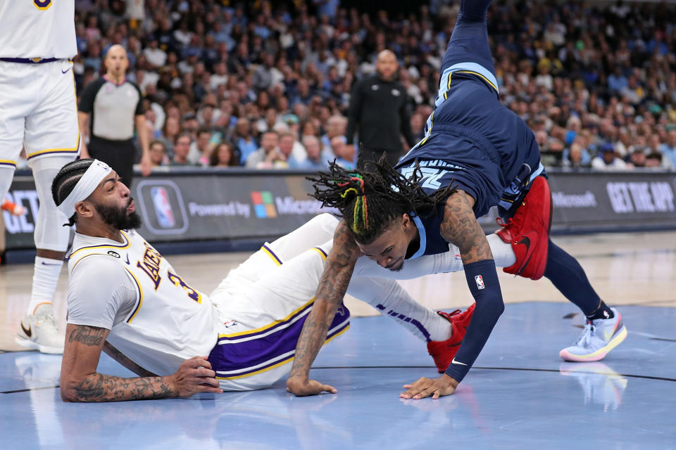 MEMPHIS, TENNESSEE - APRIL 16: Ja Morant #12 of the Memphis Grizzlies injures his hand during the second half against the Los Angeles Lakers during Game One of the Western Conference First Round Playoffs at FedExForum on April 16, 2023 in Memphis, Tennessee. NOTE TO USER: User expressly acknowledges and agrees that, by downloading and or using this photograph, User is consenting to the terms and conditions of the Getty Images License Agreement.  (Photo by Justin Ford/Getty Images)