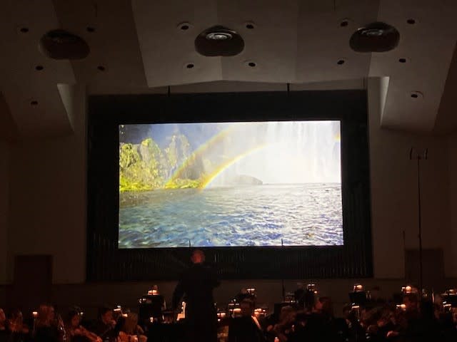 An image of the “Liquify” film, as the QCSO performed the Michael Abels piece Feb. 4, 2024 at Centennial Hall (photo by Jonathan Turner).