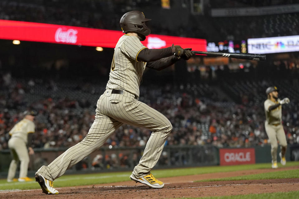 San Diego Padres' Eric Hosmer hits a two-run single against the San Francisco Giants during the second inning of a baseball game in San Francisco, Wednesday, Sept. 15, 2021. (AP Photo/Jeff Chiu)