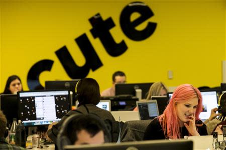 Buzzfeed employees work at the company's headquarters in New York January 9, 2014. BuzzFeed has come a long way from cat lists. REUTERS/Brendan McDermid
