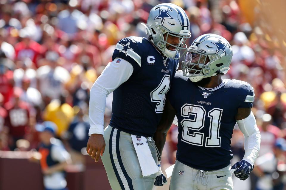 The Dallas Cowboys have re-signed running back Ezekiel Elliott, right, who played last season with the New England Patriots. Elliott signed a one-year deal for a team that chose not to sign any of the big-name running backs who were available in free agency.