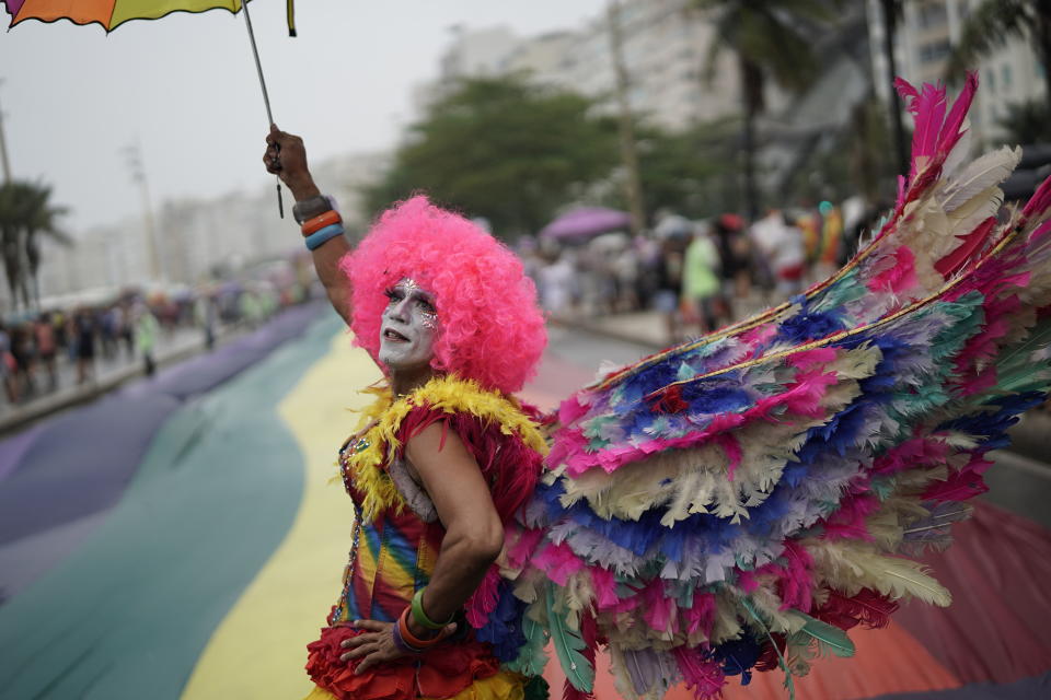 A person in costume strikes a pose during the annual gay pride parade along Copacabana beach in Rio de Janeiro, Brazil, Sunday, Sept. 22, 2019. (AP Photo/Leo Correa)