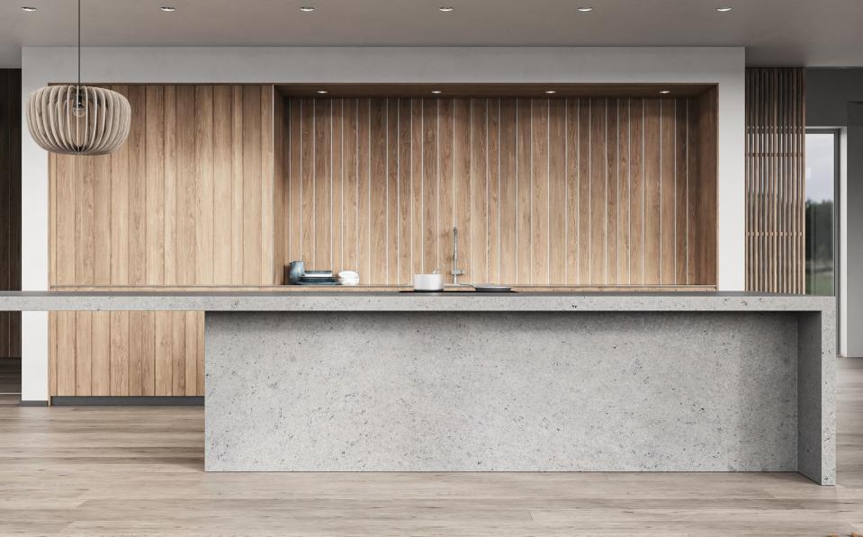 modern white kitchen with rectangular gray concrete breakfast kitchen island and counter top