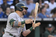 Oakland Athletics' Stephen Vogt tosses his bat after striking out during the second inning of the team's baseball game against the Kansas City Royals, Friday, June 24, 2022, in Kansas City, Mo. (AP Photo/Reed Hoffmann)