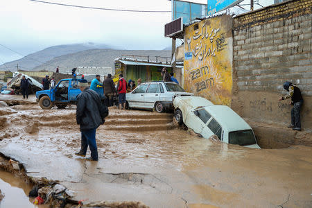 Damaged vehicles are seen after a flash flooding in Shiraz, Iran, March 26, 2019. Tasnim News Agency/via REUTERS