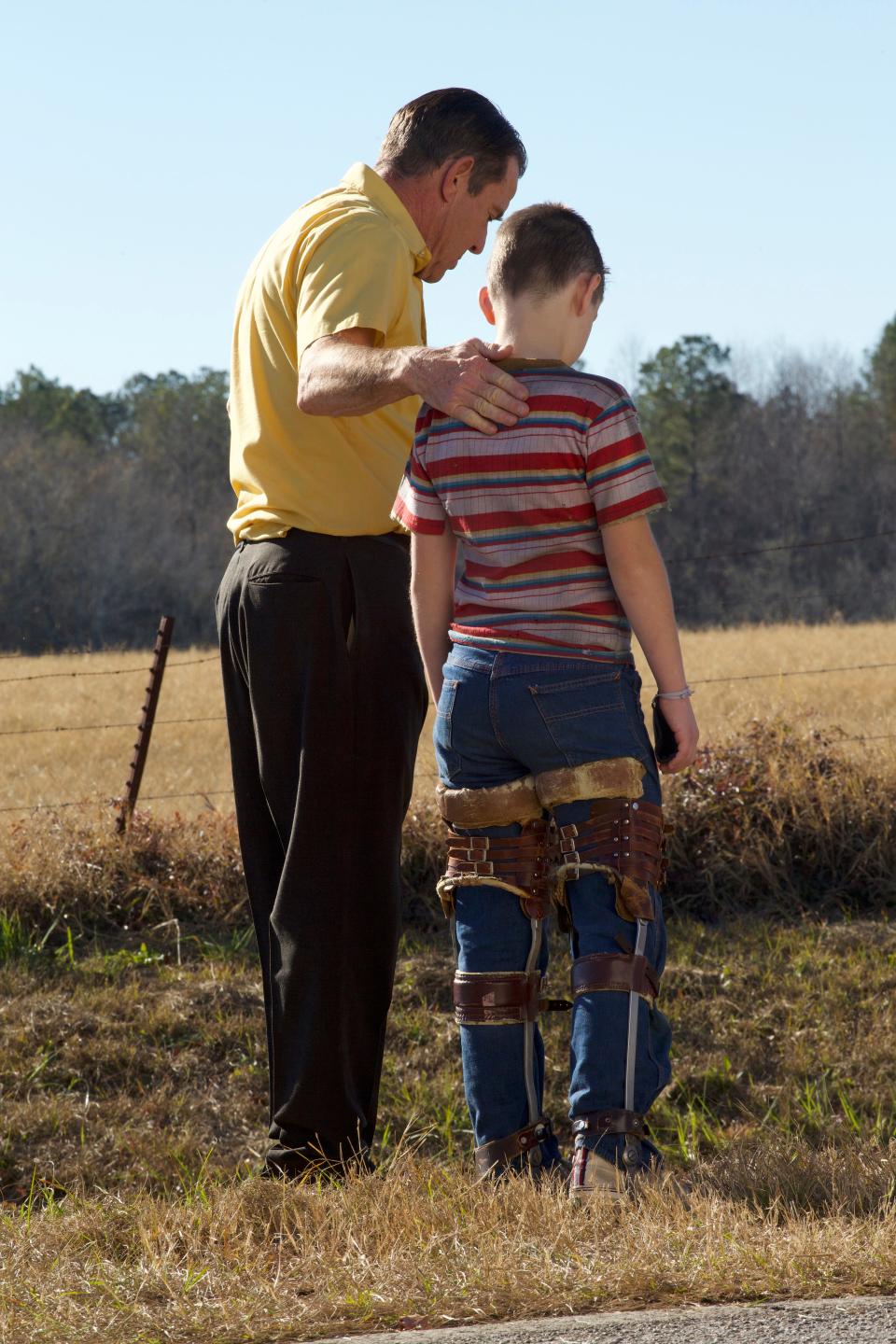 Dennis Quaid, left, stars as Pastor James Hill and Jesse Berry as young Rickey Hill in "The Hill."