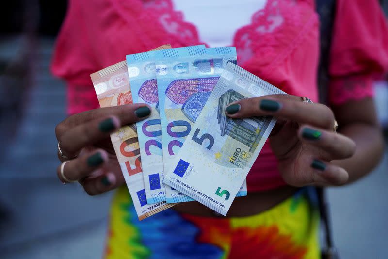 FILE PHOTO: Three exchange rates and soaring prices have left Cubans looking for dollars facing a complicated math problem