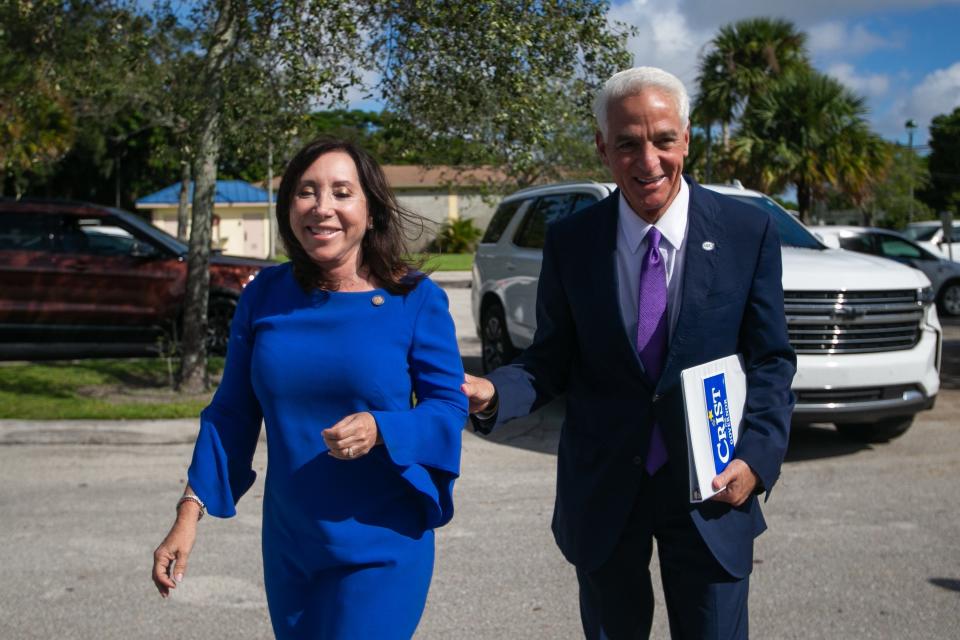 Florida State Senator Lori Berman, left, smiles while walking with Democratic candidate for Florida governor Charlie Crist to begin a a press conference at the Lake Magnolia Boat Ramp on Tuesday, October 18, 2022, in West Palm Beach, FL.