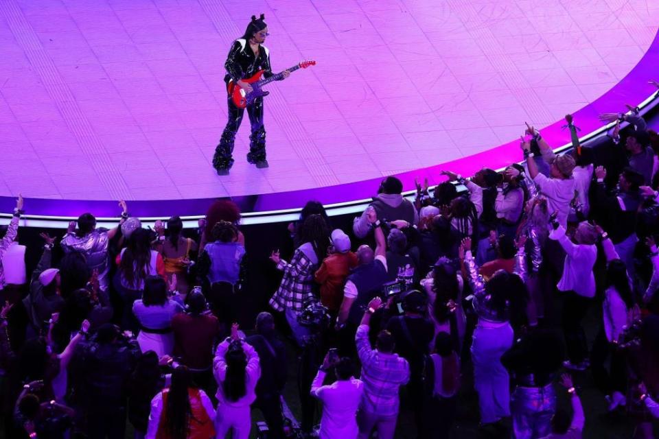 H.E.R. performs onstage during the halftime show at Super Bowl LVIII.