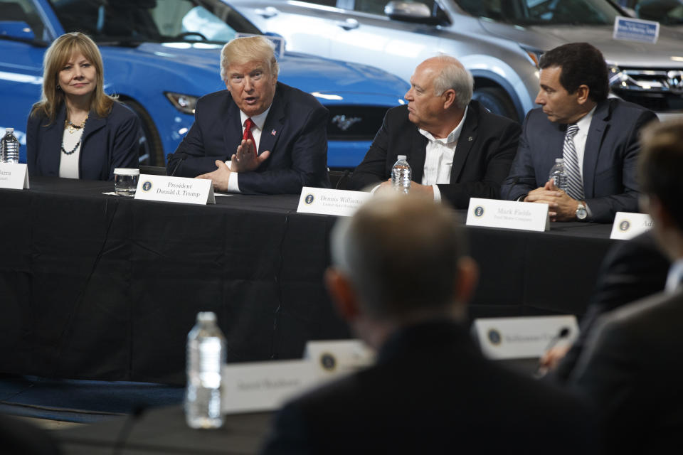 FILE - President Donald Trump speaks during a roundtable discussion at the American Center of Mobility, Wednesday, March 15, 2017, in Ypsilanti Township, Mich. From left are, GM CEO Mary Barra, the president, UAW President Dennis Williams and Ford CEO Mark Fields. Former President Donald Trump will skip the second GOP presidential debate next week to travel to Detroit as the auto worker strike enters its second week. (AP Photo/Evan Vucci, File)