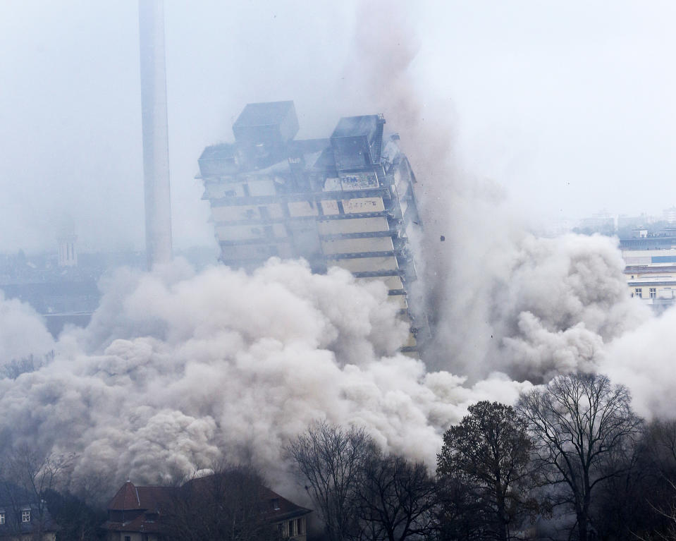 A former university tower is blown up followed by thousands of spectators in Frankfurt, Germany, Sunday, Feb. 2, 2014. (AP Photo/Michael Probst)