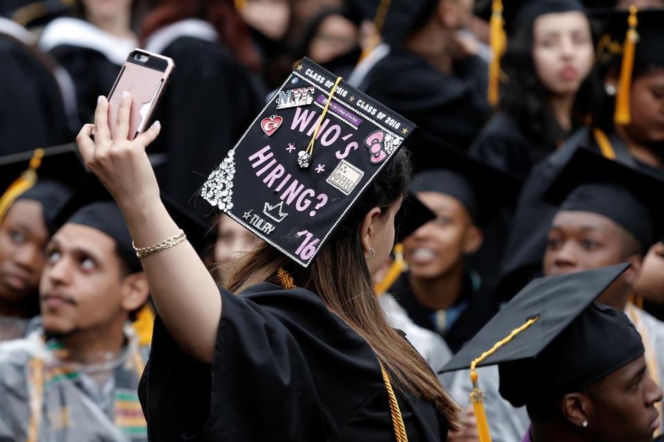 A graduating student of the City College of New York takes a selfie of the message on her cap during the College's commencement ceremony in the Harlem section of Manhattan, New York, U.S., June 3, 2016. REUTERS/Mike Segar     TPX IMAGES OF THE DAY     