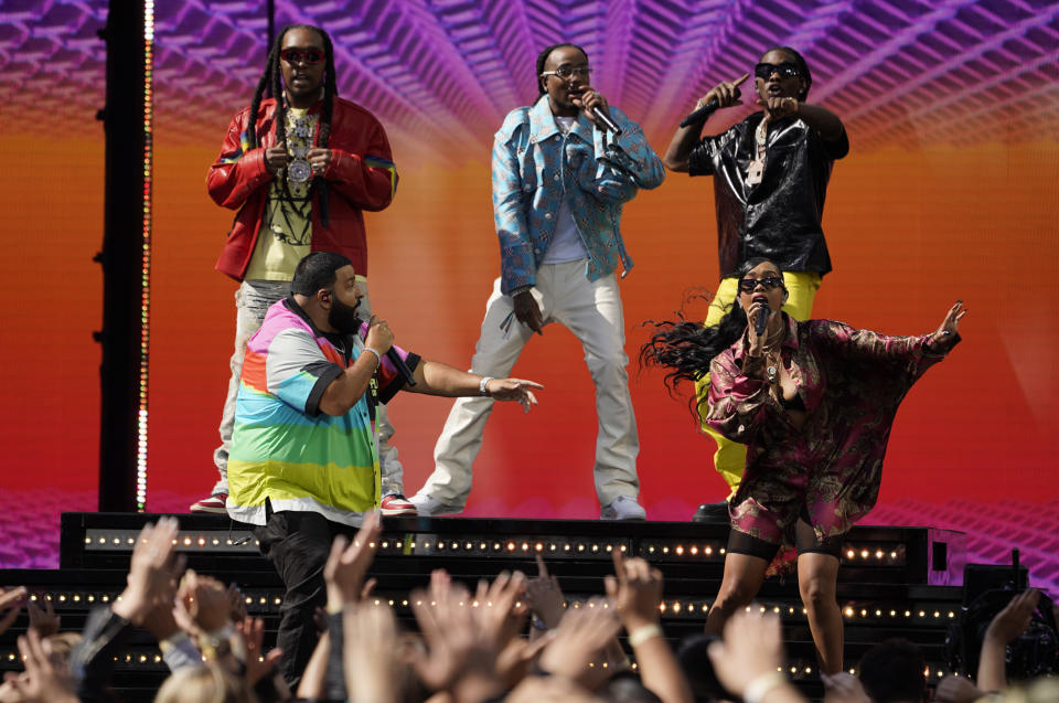 DJ Khaled, front left, and H.E.R., front right, perform with Takeoff, from background left, Quavo and Offset, of Migos, at the Billboard Music Awards on Sunday, May 23, 2021, at the Microsoft Theater in Los Angeles. (AP Photo/Chris Pizzello)