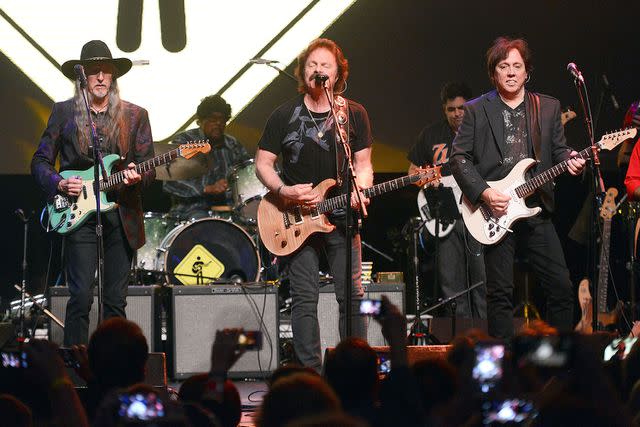 <p>Scott Dudelson/Getty</p> Patrick Simmons, Tom Johnston and John McFee of The Doobie Brothers performing in Los Angeles in October 2017