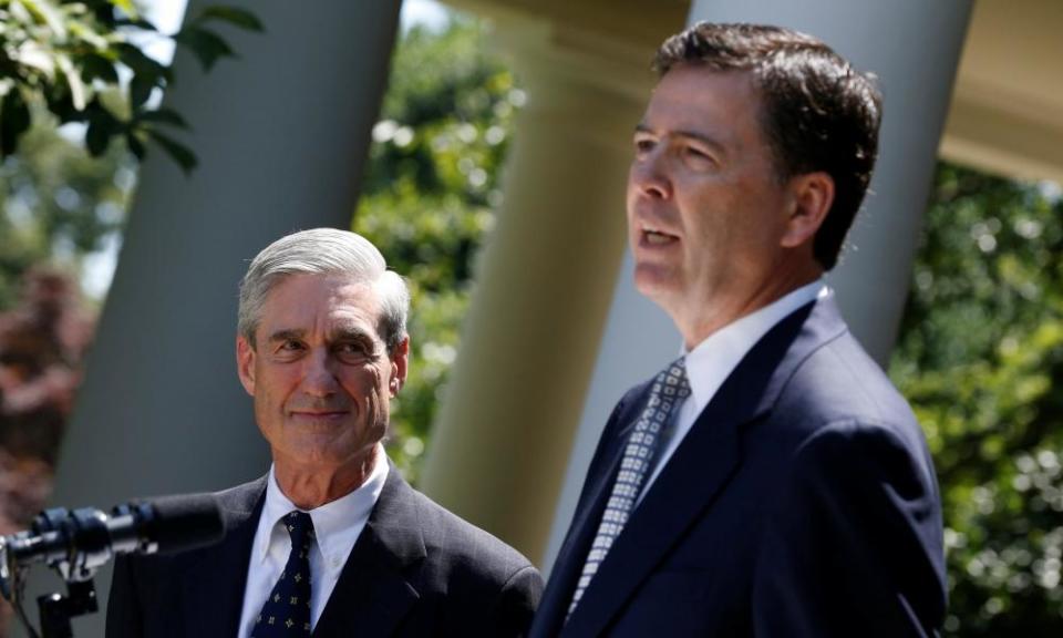 James Comey speaks alongside Robert Mueller at the White House in 2013.