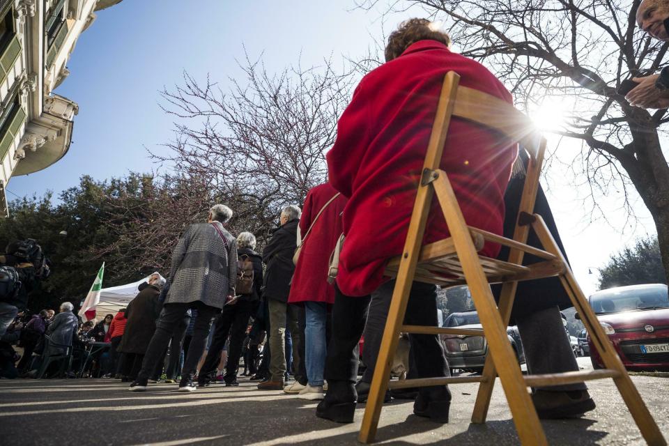 People line up to cast their ballots to elect the new leader of the Italian Democratic Party, in Rome, Sunday, March 3, 2019. Rank-and-file Democrats in Italy were voting in a primary for a new leader, as the party tries to reverse slumping popularity. The balloting Sunday comes exactly a year after the badly squabbling Democratic Party leadership lost their hold on the government in national elections. (Angelo Carconi/ANSA via AP)