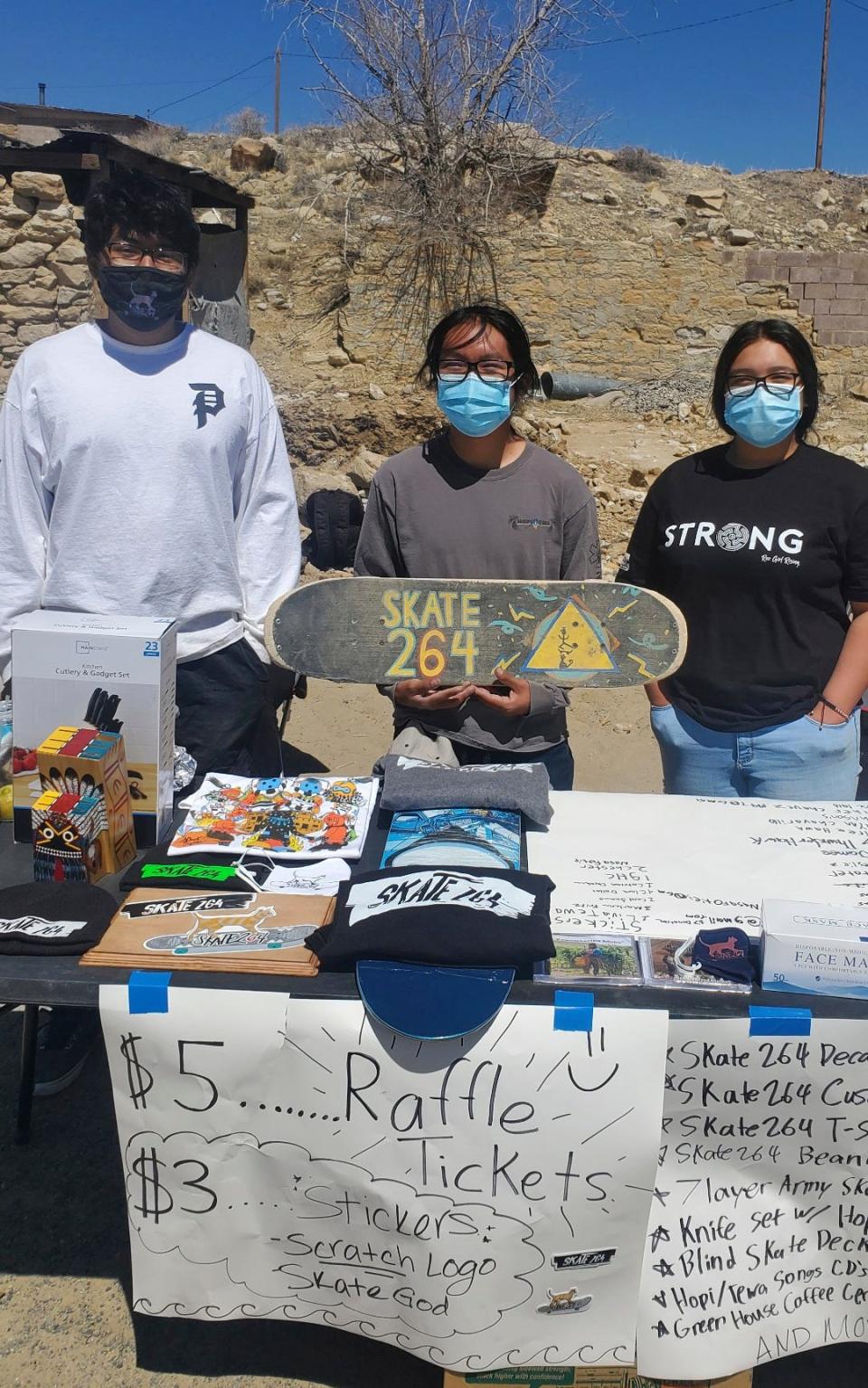 This undated photo provided by Brandon Nahsonhoya in August 2022 shows Hopi youth fundraising for a skate spot on the Hopi reservation in northeastern Arizona. A handful of Hopi youth worked together to create the skate spot that opened this spring in the Village of Tewa.