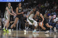 Las Vegas Aces guard Kelsey Plum, right, drives against Seattle Storm guard Jewell Loyd during the second half of a WNBA basketball game, Sunday, Aug. 14, 2022, in Las Vegas. (AP Photo/Sam Morris)