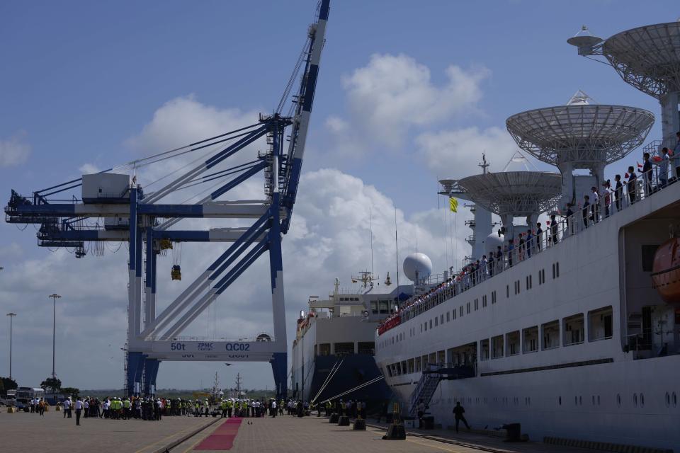 Chinese research ship Yuan Wang 5, right, is seen berthed at the Hambantota International Port in Hambantota, Sri Lanka, Tuesday, Aug. 16, 2022. The ship was originally set to arrive Aug. 11 but the port call was deferred due to apparent security concerns raised by India. (AP Photo/Eranga Jayawardena)