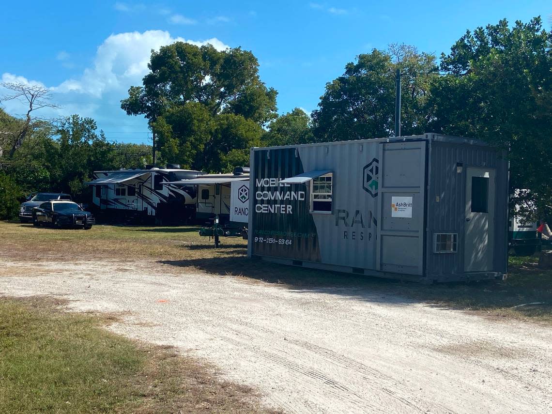 A container marked ‘Mobile Command Center’ is set on a residential lot on Plantation Key, located within the Village of Islamorada in the Florida Keys, Thursday, Feb. 16, 2023. It’s part of a state base camp to house police officers sent to the Keys to help with an increase in maritime migration from Cuba and Haiti, according to a statement from the Village of Islamorada.