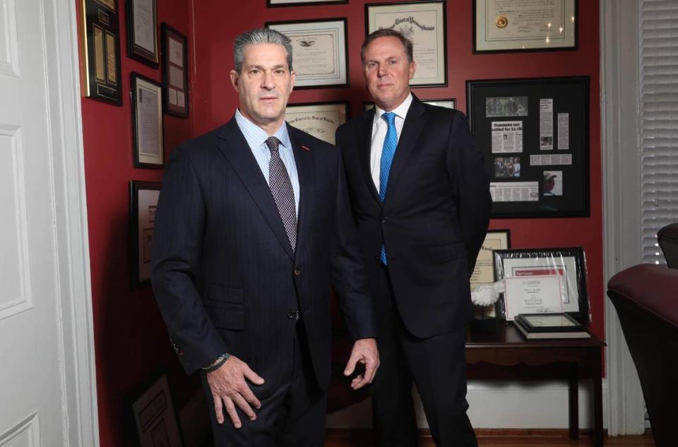 Attorneys Eric Bland, left, and Ronnie Richter pose for a portrait in Bland’s Columbia office. Bland and Richter are representing the family of Gloria Satterfield.