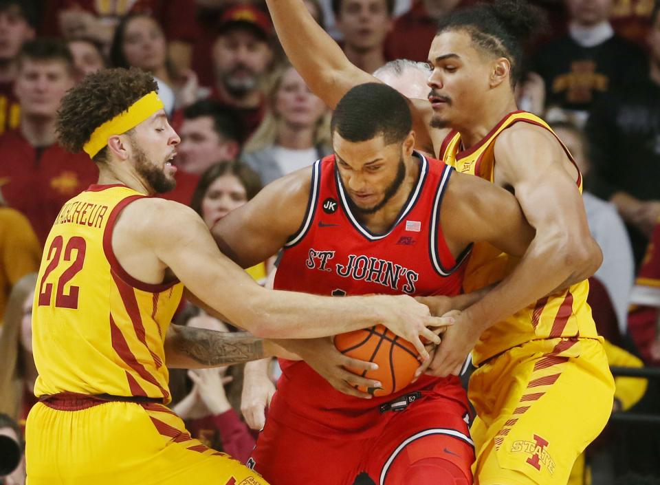 Iowa State’s Gabe Kalscheur (22) and Robert Jones defend against St. John’s Joel Soriano during Sunday’s game in Ames.