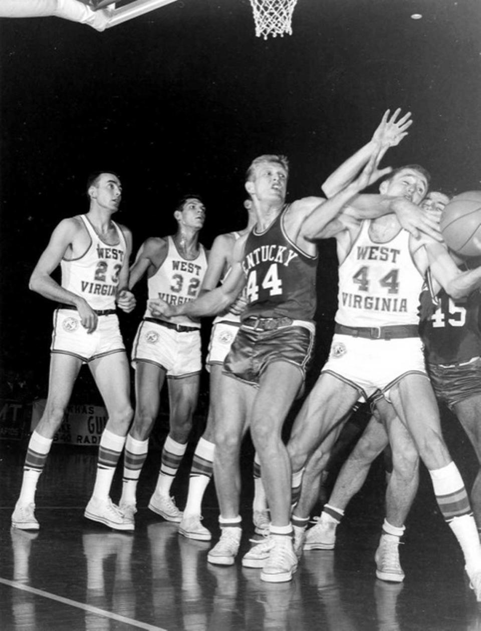 Kentucky’s Cotton Nash battles for a loose ball during a 1962 game against West Virginia in Memorial Coliseum. “Cotton was a tremendous athlete. Really good speed for a guy his size,” Nash’s former UK teammate Larry Conley said in 2020. “He had a lot of strength, (and) great moxie about how to play the game.”