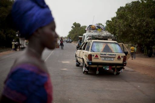 Traffic is seen at the Senegal-Guinea Bissau border crossing at Mpack on April 13, after the border was closed following a coup in Guinea Bissau a day earlier. Opposition parties in Guinea-Bissau were to meet to thrash out a "unity government" after a military coup derailed presidential elections