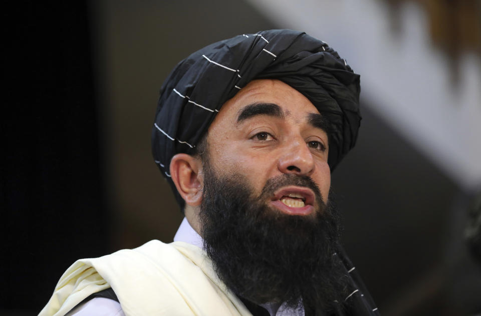Taliban spokesman Zabihullah Mujahid speaks at at his first news conference, in Kabul, Afghanistan, Tuesday, Aug. 17, 2021. Mujahid vowed Tuesday that the Taliban would respect women's rights, forgive those who resisted them and ensure a secure Afghanistan as part of a publicity blitz aimed at convincing world powers and a fearful population that they have changed. (AP Photo/Rahmat Gul)