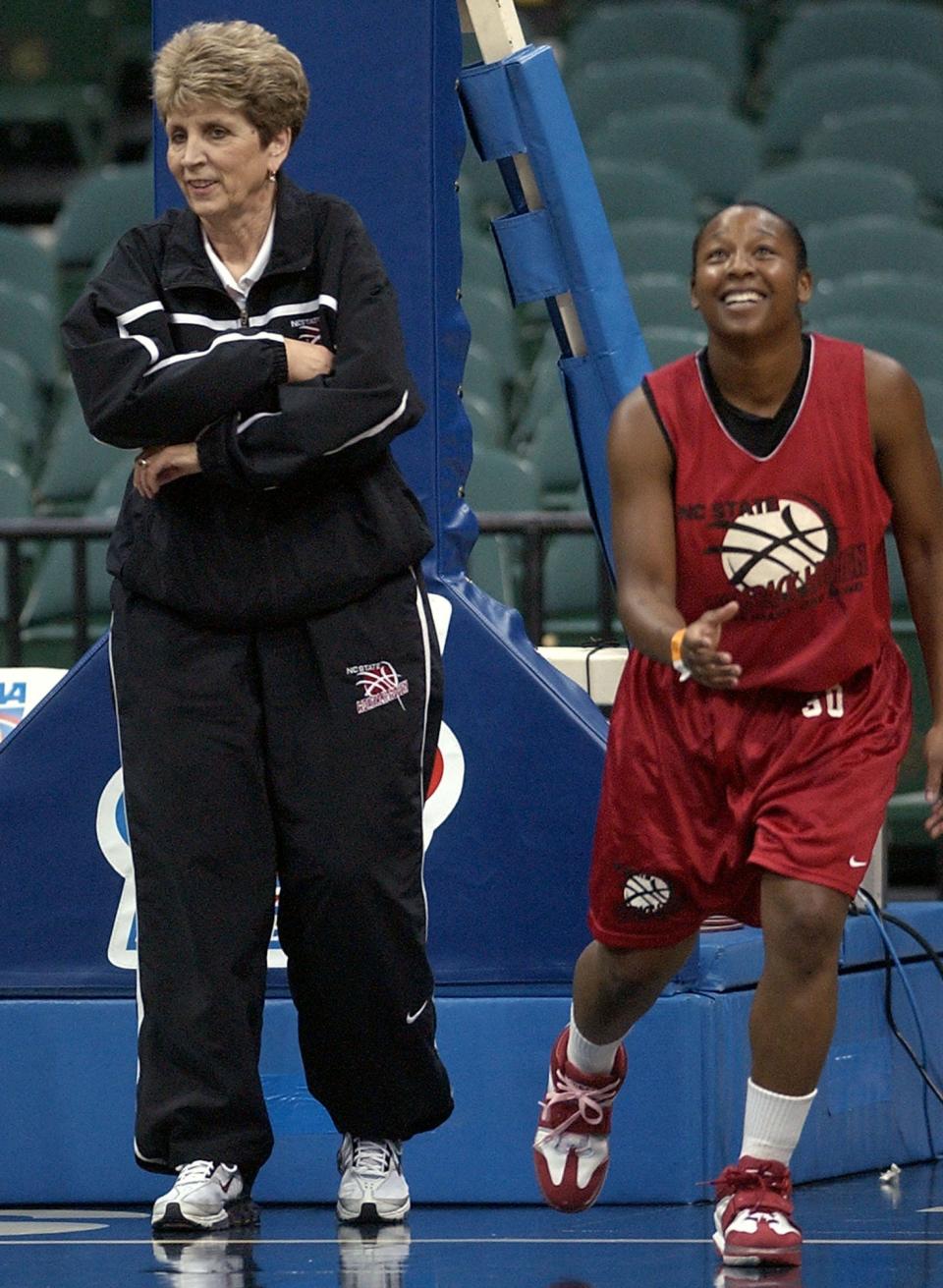 North Carolina State coach Kay Yow, left, and player Kendra Bell, right, laugh during practice Friday, March 18, 2005, in Dallas. N.C. State will take on Middle Tennessee in the first round of the NCAA tournament Saturday. (AP Photo/Tony Gutierrez)