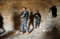 Iraqi Federal Police arrive at the frontline at Bab al Jadid district as the battle against Islamic State's fighters continues in the old city of Mosul, Iraq, March 26, 2017. REUTERS/Youssef Boudlal